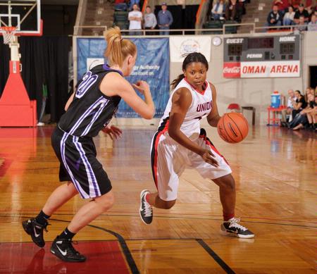 Hope Adams drives around Avila University's defense in game one of the NAIA National Championship. - Photo by Morris Abernathy