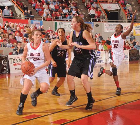 Kayla Hudson drives past Avila University's defense to go for a lay-up in game one of the NAIA National Championship.  - Photo by Morris Abernathy