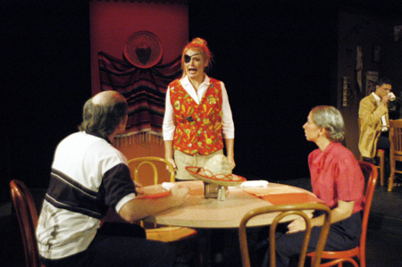 Molly Wiliams as Cassandra Hooper addresses Patrick Myers and Miranda Wallace as Marvin and Millie Standard while Stephen Kenney as Harvey Gold sips coffee in the background in <i>You Have To Serve Somebody</i>. - Photo by Jim Veneman