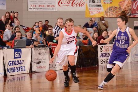 Kayla Hudson stays one step ahead of her Olivet Nazarene University opponent during game two of the NAIA National Championship. - Photo by Morris Abernathy