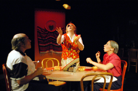 Molly Williams as Cassandra Hooper attempts to juggle sopapillas for Patrick Myers and Miranda Wallace as Marvin and Millie Standard in <i>You Have To Serve Somebody</i>. - Photo by Jim Veneman