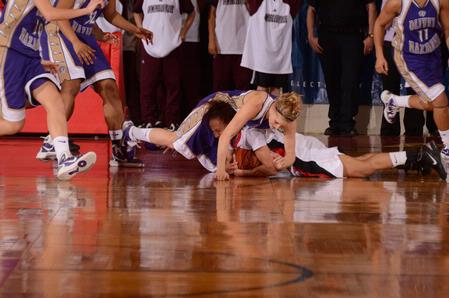 LaTesa McLaughlin takes a hard hit late in game two of the NAIA National Championship. McLaughlin went to the hospital as a precaution but was released the same night.  - Photo by Morris Abernathy
