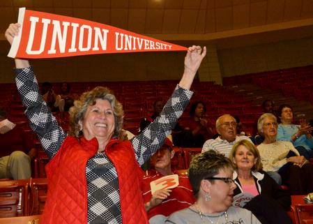 Crickett Tharp, Union booster, holds her banner in support of the Lady Bulldogs. - Photo by Beth Spain