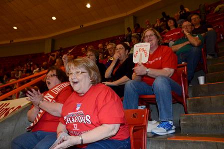 Sandy Maclemore, Sherrel Dorris, and Debbie Cook cheer as the Lady Bulldogs score a basket in the semifinals of the NAIA National Championship. - Photo by Beth Spain