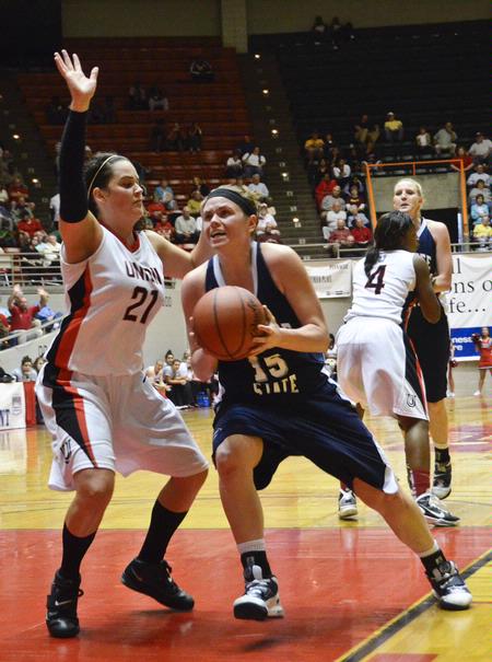 Kayla Bryant goes for the block during the NAIA National Championship quarterfinals game against Shawnee State University. - Photo by Beth Spain