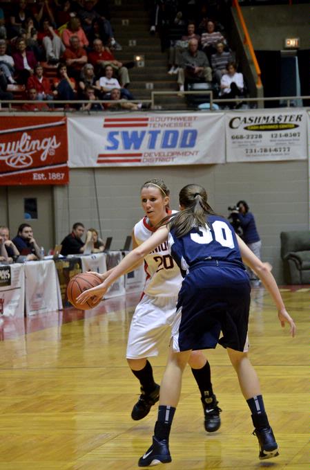 Kayla Hudson dribbles past her Shawnee State University opponent in the semifinals of the NAIA National Championship. The Lady Bulldogs won the game 58-40 and advanced to the final game.  - Photo by Beth Spain