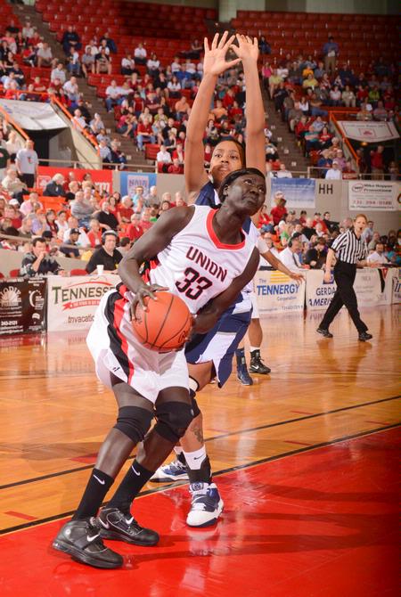 Zeinab Chan goes up for a shot around her Shawnee State University opponent in the semifinals game of the NAIA National Championship. The Lady Bulldogs won the game and advanced to the finals.  - Photo by Morris Abernathy
