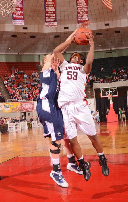 Lavanda Ross goes up for a shot against her Shawnee State University opponent. - Photo by Morris Abernathy