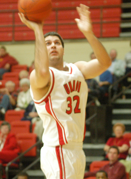 Junior forward Bruno Martinessi (32) goes in for a lay-up. - Photo by Courtney Ross