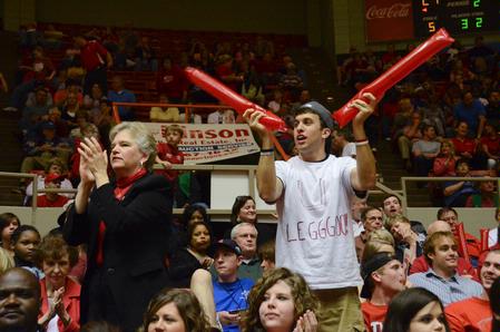 Lanese Dockery, first lady of the university, and Chase Tuggle, junior youth ministry major, stand and cheer for the Lady Bulldogs. - Photo by Beth Spain