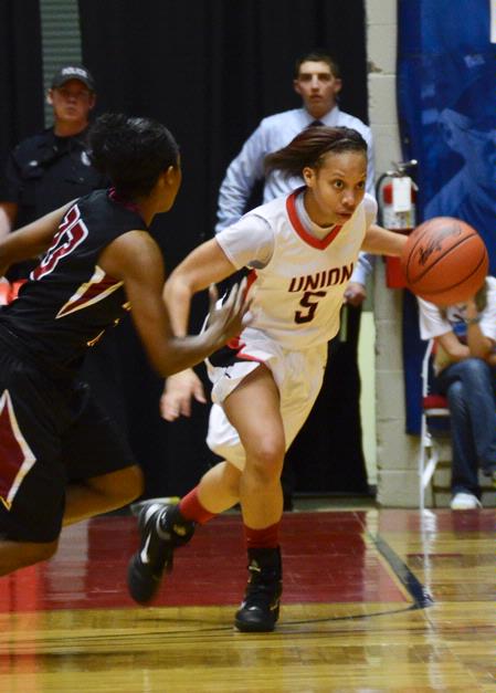 LaTesa McLaughlin takes the ball down the court in the last game of the NAIA National Championship.  - Photo by Beth Spain