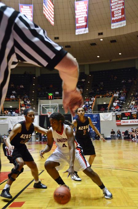 Hope Adams drives the ball past Azusa Pacific defenders during the NAIA National Championship. - Photo by Beth Spain