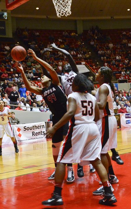 Zeinab Chan struggles to rebound the ball in the second half of the NAIA championship game. - Photo by Beth Spain
