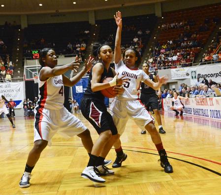 Hope Adams and LaTesa McLaughlin guard their Azusa Pacific opponent in the final game of the NAIA National Championship. - Photo by Beth Spain