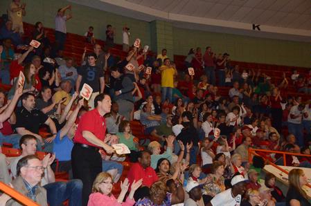 Fan jump to their feet to cheer as the final game of the NAIA National Championship becomes intense. - Photo by Beth Spain