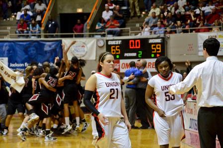 Kayla Bryant and Lavanda Ross return to the bench after a tough 65–59 loss to Azusa Pacific in the NAIA National Championship. - Photo by Beth Spain