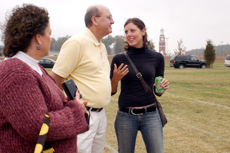 Senior Elizabeth Shackleford escorts her parents to a Chi Omega barbeque during Family Weekend 2003. - Photo by Kristen Nicole Sayres