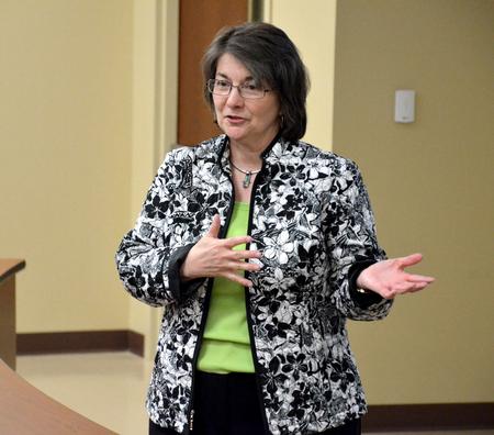 Mary Anne Poe, director of the Center for Just and Caring Communities, speaks during the Town & Gown in Providence Hall. - Photo by Deanna Santangelo