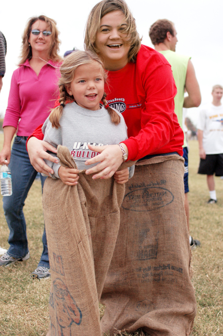Sophomore Amanda Rushing and her little sister prepare to participate in the First Annual Family Weekend Potato Sack Race. - Photo by Kristen Nicole Sayres