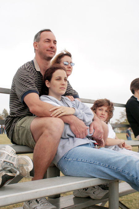 Freshman Chelsea Mytyk enjoys the company of her parents during Family Weekend 2003. - Photo by Kristen Nicole Sayres