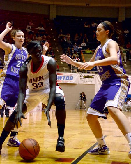 Zeinab Chan takes a powerful dribble before driving to the basket. Union Lady Bulldogs played Olivet Nazarene in the second round of the 2011 NAIA Division I Women's Basketball National Championship. Union won 81 to 69.  - Photo by Ebbie Davis