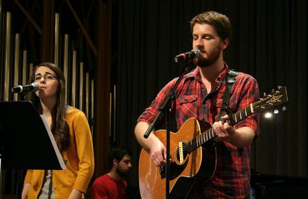 Natalie Wittman, junior English major, and TJ Hester, junior philosophy major, sing during chapel. - Photo by Deanna Santangelo
