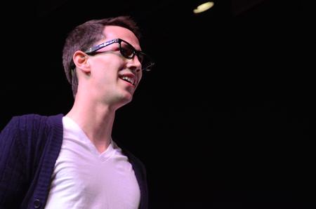 Sam Ritter, junior music performance major, looks on during the performance with the independent group "There and Back Again" at the 14th annual Variety Show held at the Carl Perkins Civic Center.  - Photo by Abigail Harris