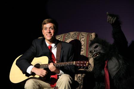 Josh Shelley, freshman business major, plays guitar during the Lambda Chi Alpha small group performance at the 14th annual Variety Show. - Photo by Deanna Santangelo
