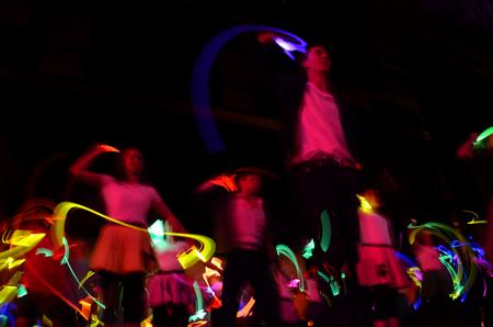 The independent group "There and Back Again" performs a <em>Back to the Future</em> skit with glow sticks at the 14th annual Variety Show.  - Photo by Ebbie Davis