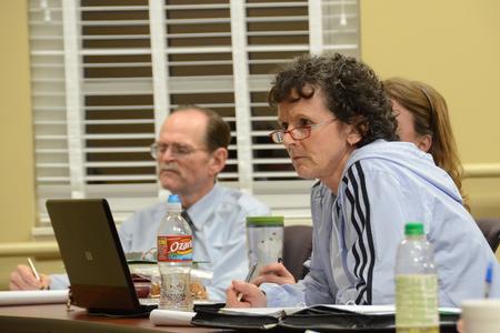 Community members and adult learners listen as Hal Poe speaks about creativity and ideas during the Town and Gown lecture series. - Photo by Beth Spain