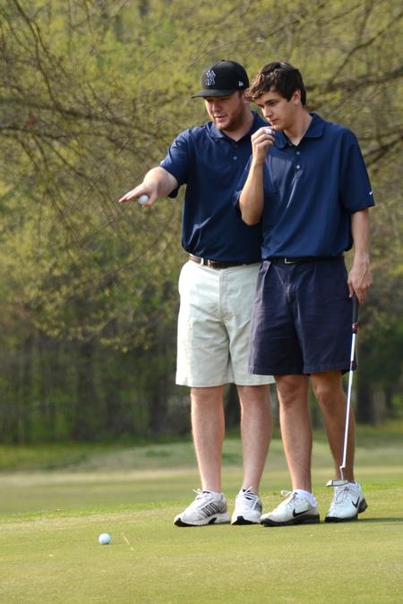 Mike Phelan, senior business administration major, and Hunt Magee, sophomore biology major, participate in the second annual ZTA Pink Links golf tournament benefitting Breast Cancer Awareness. - Photo by Beth Spain