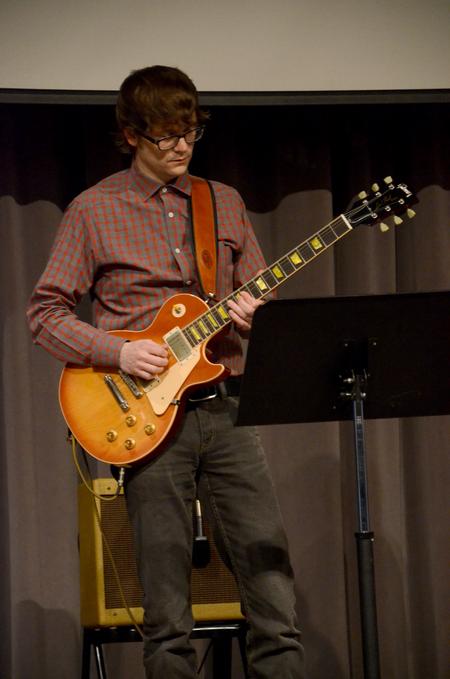 Greg Thornbury, dean of the school of theology and missions, plays with the worship team during chapel. - Photo by Ebbie Davis