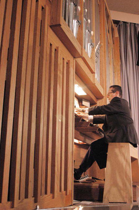 Professor of Music Ron Boud plays the organ during <i>A Union Christmas: A Ceremony of Carols</i>. - Photo by Lindsay Stavish