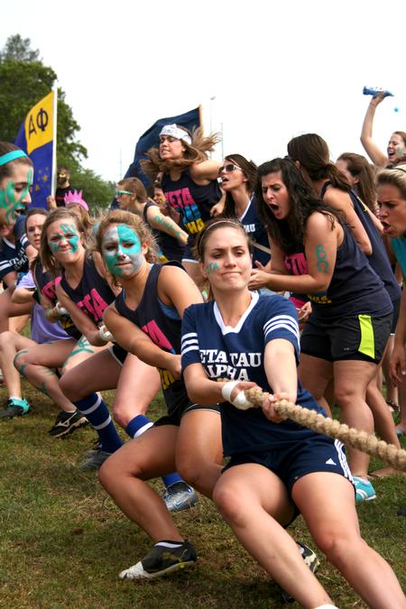 Zeta Tau Alpha dominates the rope pull as their sorority sisters cheer them on at Greek Olympics. - Photo by Deanna Santangelo