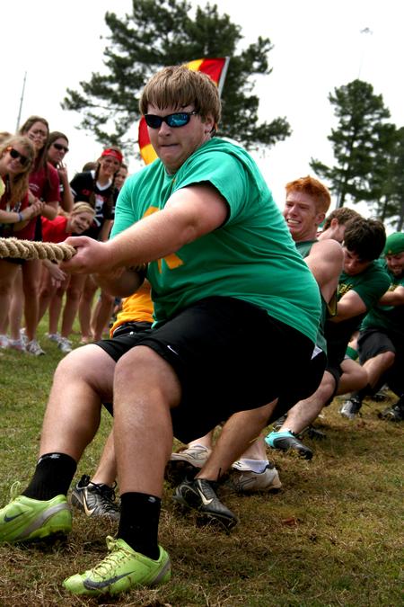 Jacob Williams, sophomore accounting major, competes in the rope pull with his brothers in Lambda Chi Alpha during Greek Olympics. - Photo by Deanna Santangelo