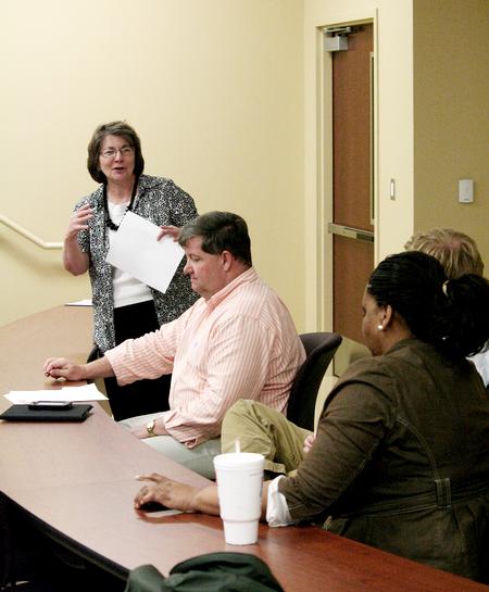 Mary Anne Poe, director of the Center for Just and Caring Communities, addresses the panel at the last night of the Town & Gown lecture series on the subject of Children and Community. - Photo by Deanna Santangelo