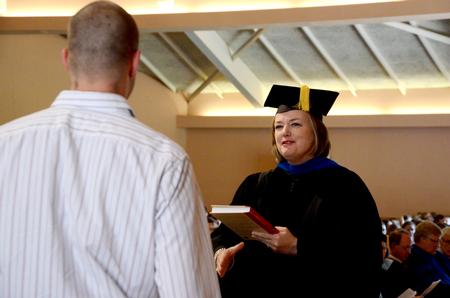 Carla Sanderson, provost and executive vice president, presents the Broadman and Holman Award to Hunter Bragg, senior history major, during Awards Day chapel. - Photo by Deanna Santangelo