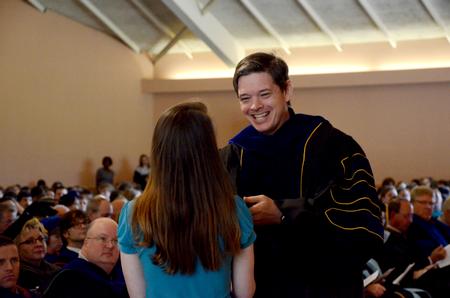 Angela Abbamonte, senior journalism major, receives the Kina S. Mallard Communication Arts Student of the Year Award from Web Drake, associate professor of communication arts and department chair, during Awards Day chapel. - Photo by Deanna Santangelo