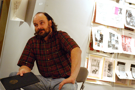 Art professor Lee Benson gives insight on the work of featured artist John Bjerklie during a Gallery Talk at Family Weekend 2003. - Photo by Jonathan Blair