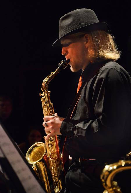 Ethan Giles, junior Christian studies major, plays an alto saxophone solo as the Union University Jazz Band plays for students and the Jackson community.  - Photo by Victoria Stargel