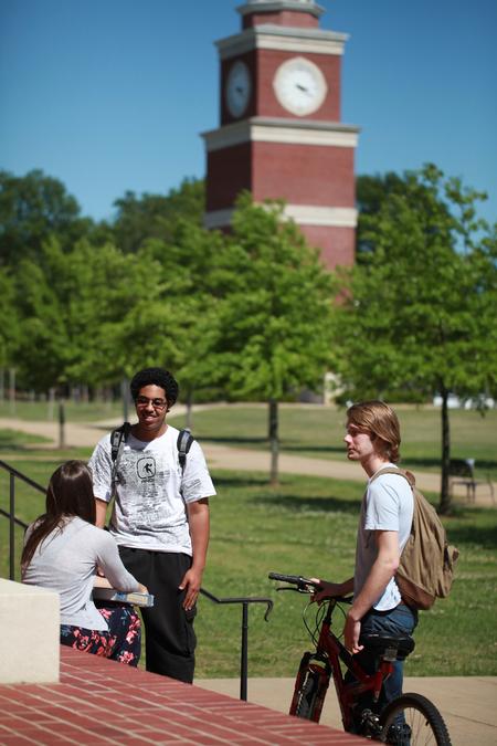 Beth Spain, Matt Arnold, and Joe Dresser chat outside of Jennings Hall between classes.  - Photo by Kristi McMurry Woody