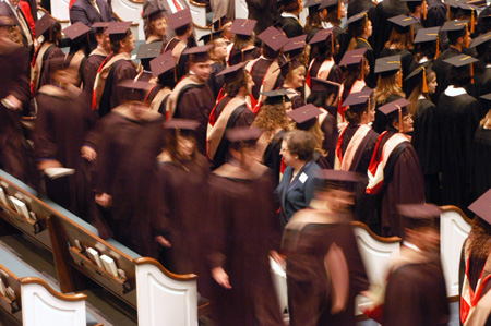 Graduates line up for their diplomas during Fall Graduation 2003. - Photo by Justin Veneman
