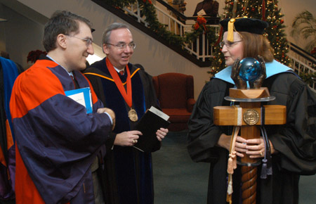 Commencement speaker Dr. Robert P. George of Princeton University speaks with President David S. Dockery and Faculty Member of the Year Ann Singleton shortly before Fall Graduation 2003. - Photo by Jim Veneman