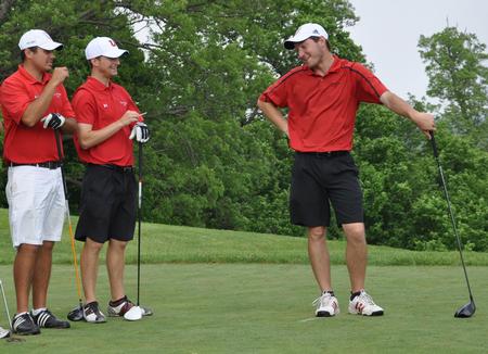 Micah Gentle (right) talks with Ryan Chandler (left) and Brett Barry during the practice round at the NAIA National Tournament at TPC Deere Run. - Photo by Steven Aldridge
