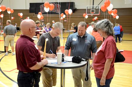 Ken Litscher, director of residence life, talks with Matt, freshman biblical studies major, and his parents, Timm and Donna, during New Student Move-in. - Photo by Jacob Moore