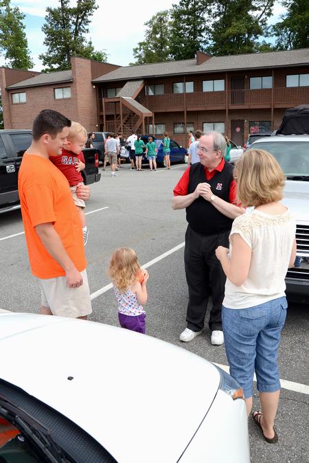 David S. Dockery, president of the university, visits the Heritage Complex to mingle with new students and their families during New Student Move-in. - Photo by Jacob Moore