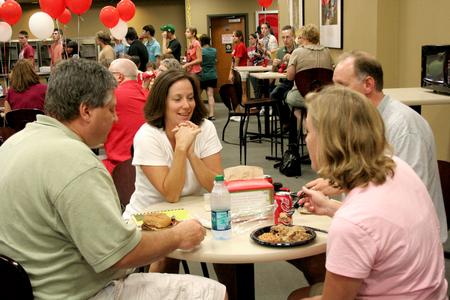 John Longworth (left), class of 1987, Sandra Longworth, class of 1986, talk with other Union alumni, Jimmy Graves, class of 1989, and Jennifer Graves, class of 1988, during the freshmen picnic in Brewer Dining Hall. - Photo by Deanna Santangelo