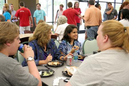 New students and their families enjoy dinner during the freshmen picnic in the Brewer Dining Hall. - Photo by Deanna Santangelo