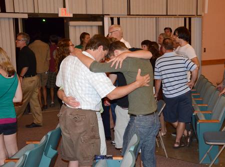 Families spend time together at the end of the New Student and Parent Worship Service in the GM Savage Memorial Chapel. - Photo by Jacob Moore