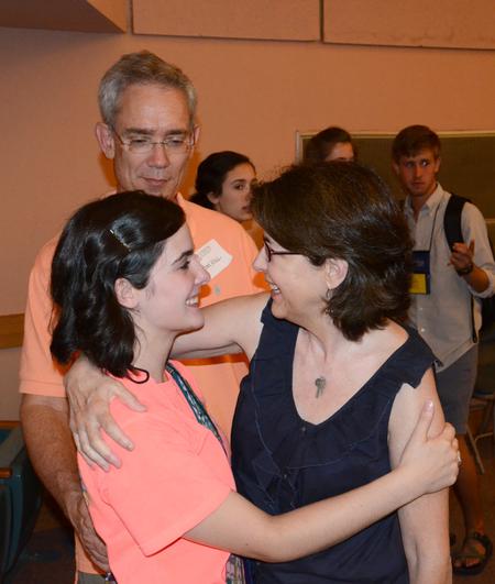 Freshman Elizabeth Hill gives her parents, Tom and Debbie Hill, a goodbye hug  after a time of worship for new students and their families. - Photo by Jacob Moore